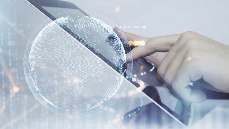 A hand touches a tablet screen with a digital globe and abstract network graphics overlaying the image, suggesting global connectivity and technology.