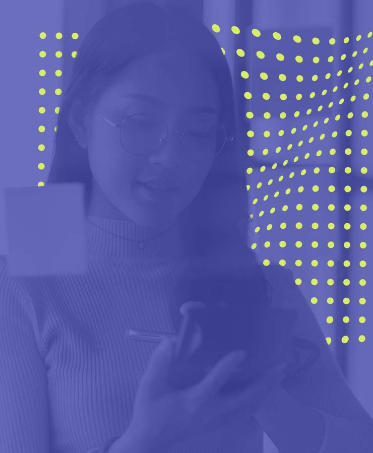 A woman wearing glasses looks at a smartphone and holds a pen, with sticky notes on glass and a background of yellow dots on a blue overlay.