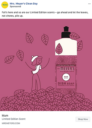 A bottle of Mrs. Meyer's Clean Day Mum scented dish soap is surrounded by falling leaves and a cartoon figure enjoys the autumn scene.